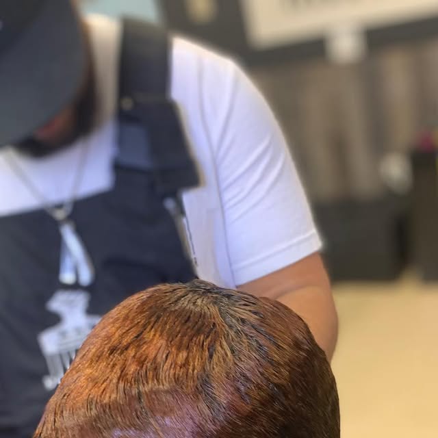 Barber in the chair at Greene's Barber Service